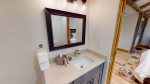 En suite bathroom with marble counters 